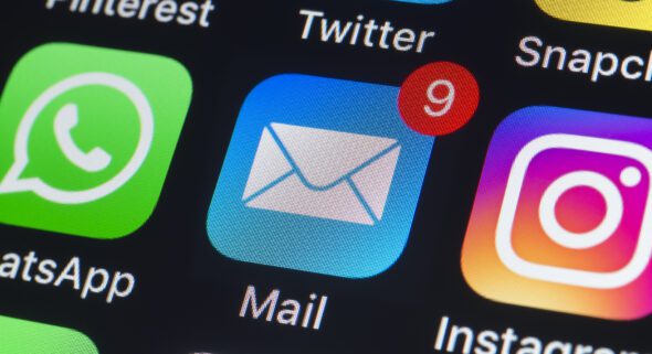 Apple mail icon with unopened emails on an iPhone screen