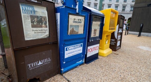 Newspaper vending machines along the sidewalks of downtown DC