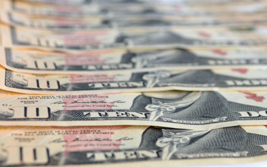 A stack of Ten Dollar Bills.