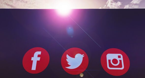 Facebook, Twitter and Instagram; the top three social media platform logos on a bill board