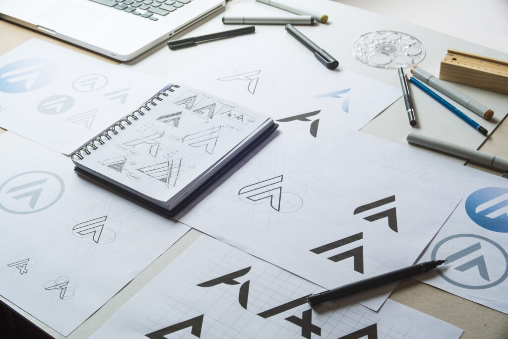 Graphic designer sketching logo concepts