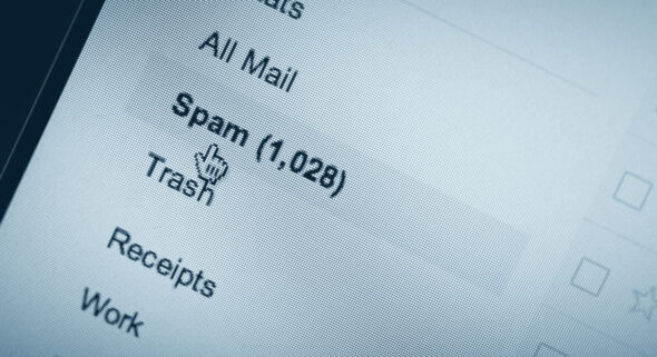 Email spam folder packed with spam email on a laptop