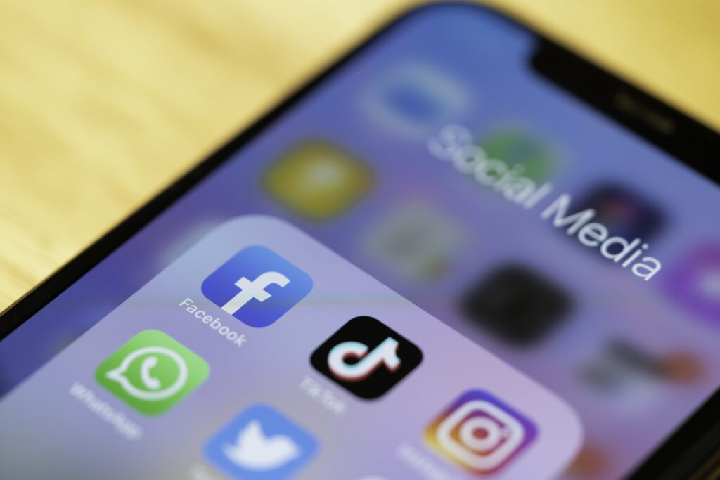 iPhone 11 Pro showing Social media applications on its screen