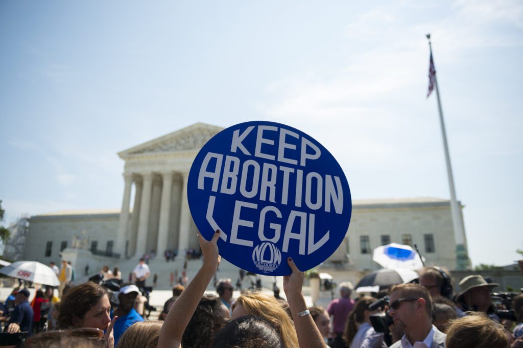 Keep abortion legal sign in front of protest at Supreme Court