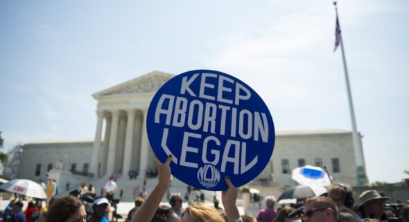 Keep abortion legal sign in front of protest at Supreme Court