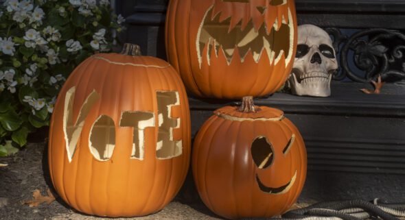 The word VOTE is carved onto a halloween pumpkin decoration in the Logan neighborhood of Washington, DC.