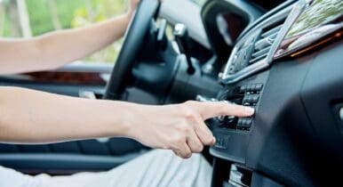 Person tuning a car radio