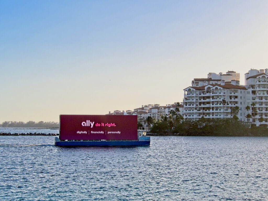 A floating digital billboard reenters the port of Miami after advertising along the Miami beach shoreline
