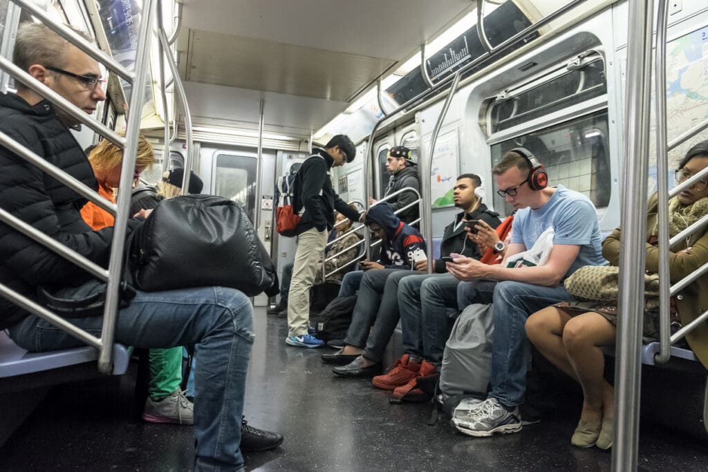 People traveling in a subway train in New York city
