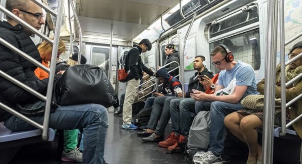 People traveling in a subway train in New York city